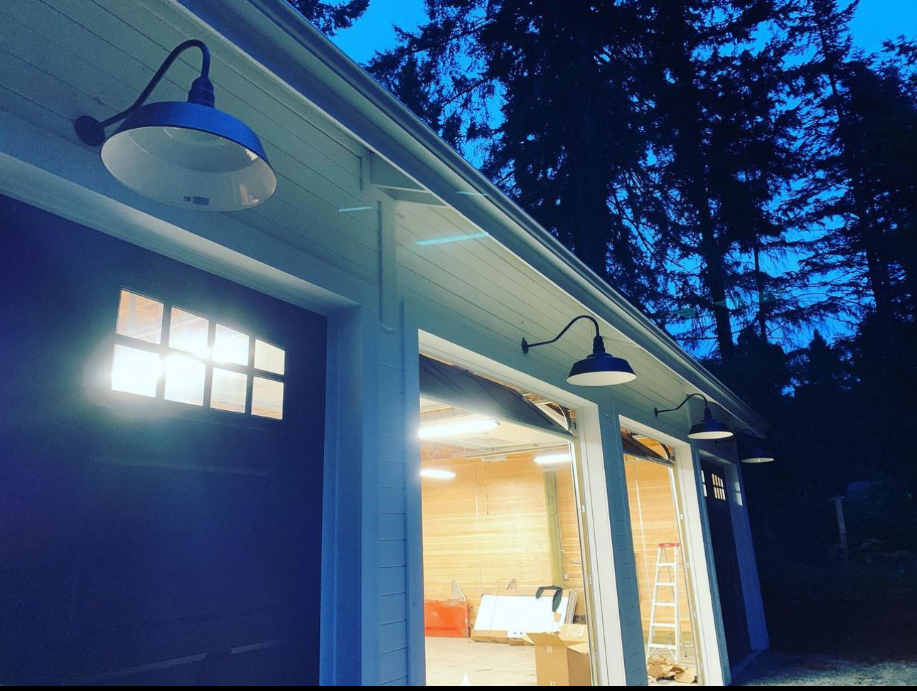 A garage with a light on the side of it