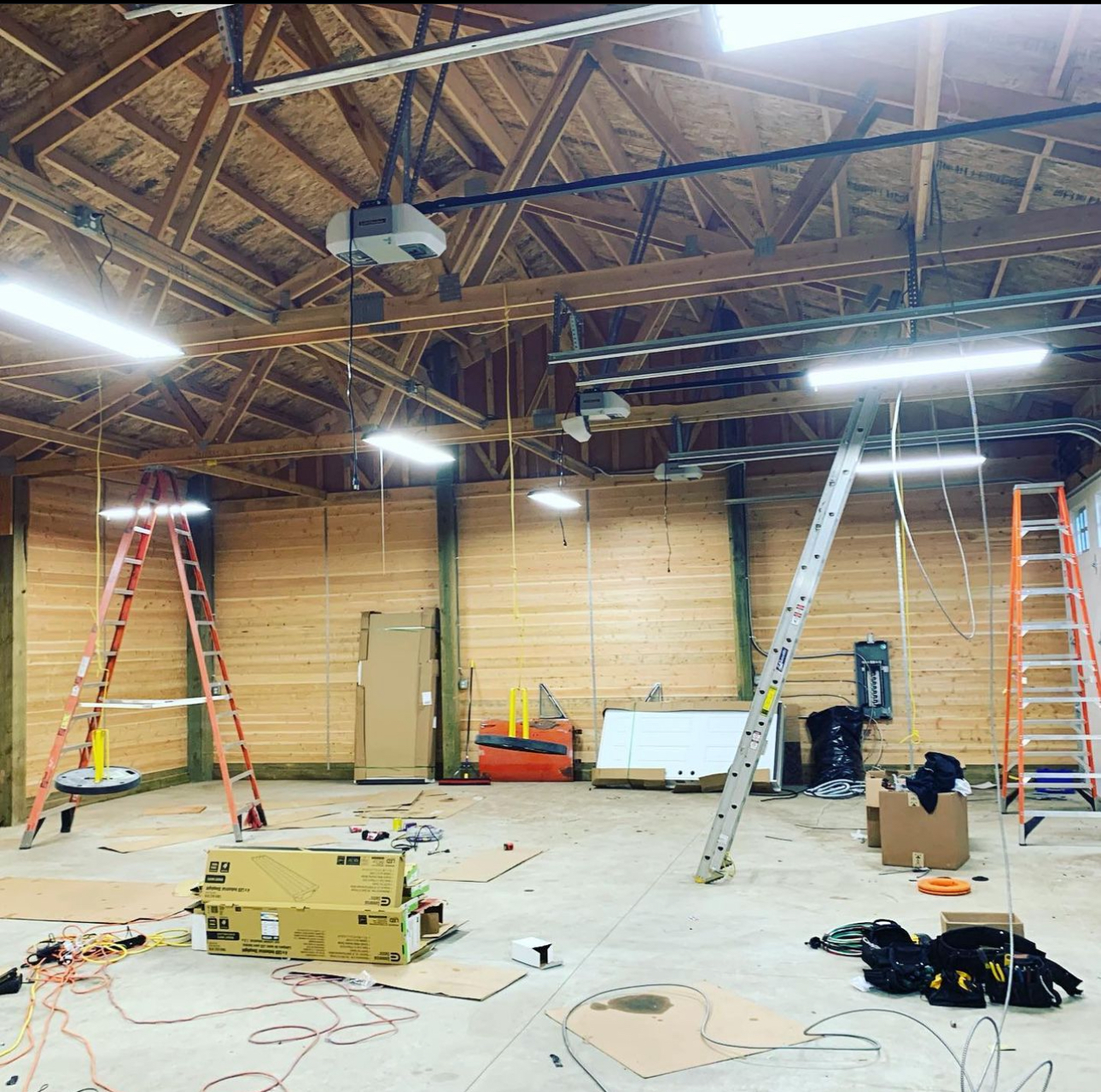 A large room with a lot of wires hanging from the ceiling