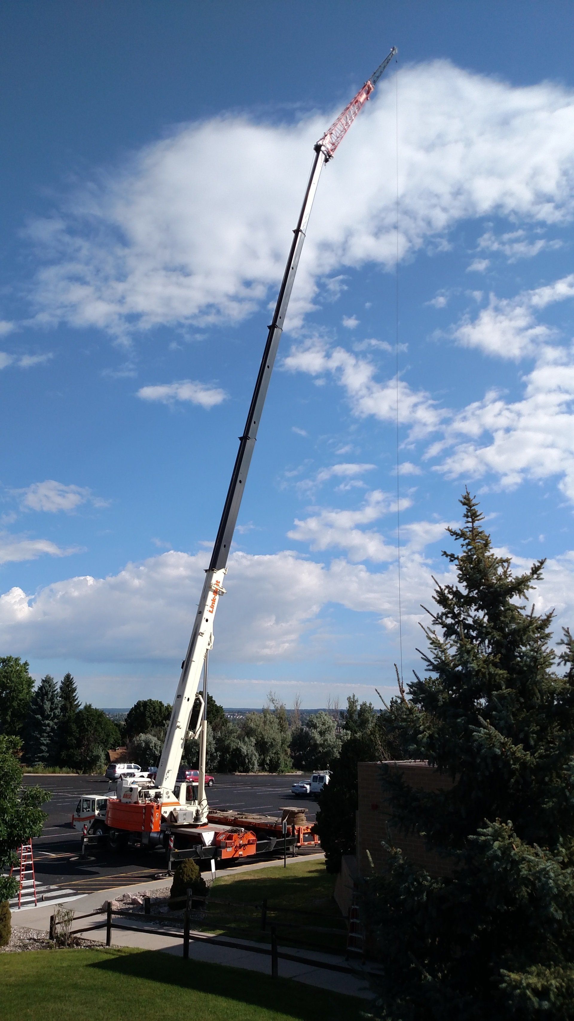 Building with Hydraulic Crane — Denver, CO — Erix Crane & Rigging