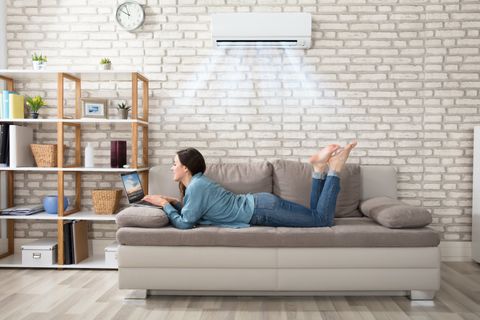 Woman Lying On Sofa — Air Conditioner Cleaning In Cairns, QLD