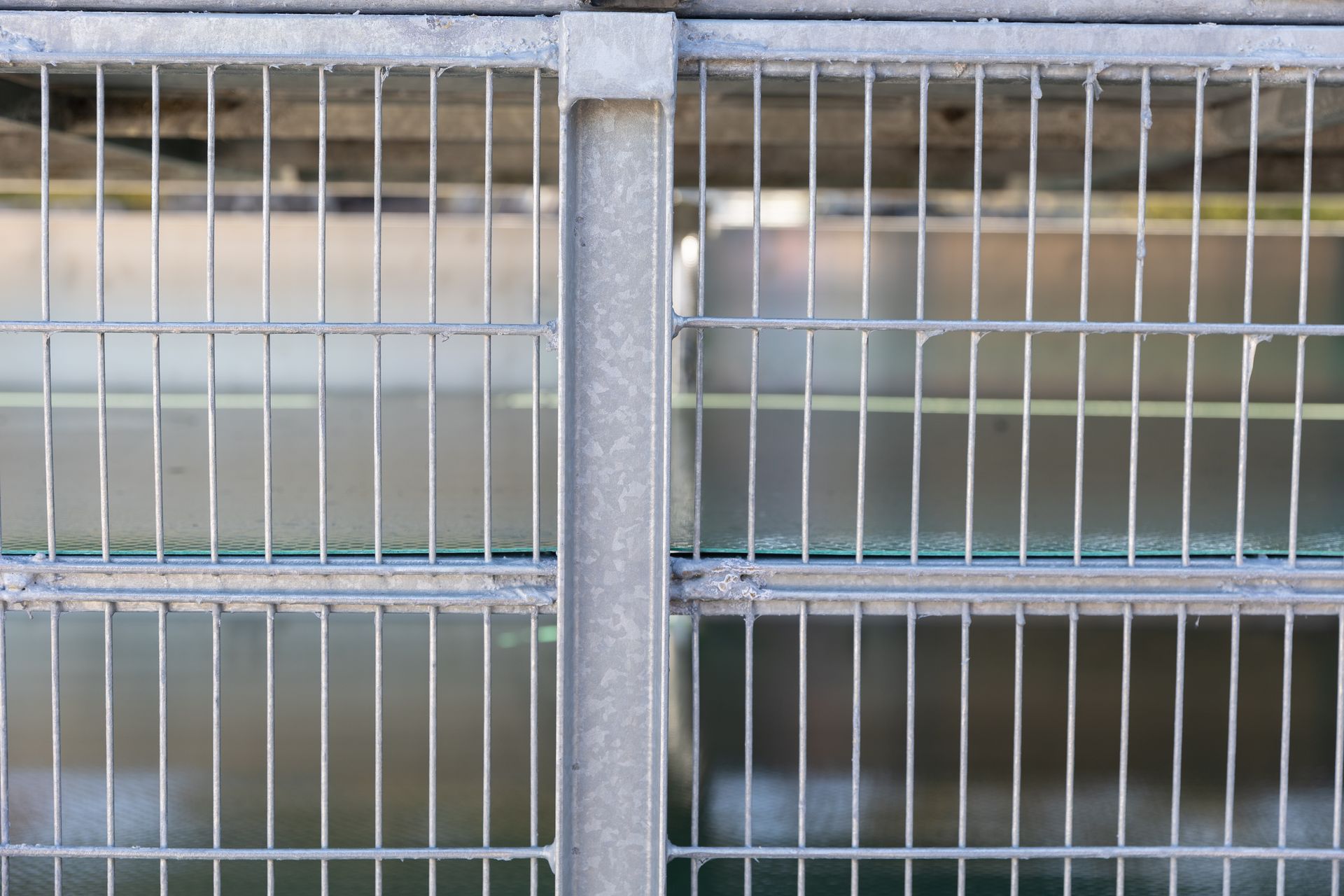Metal cage with vertical bars, possibly a window guard or enclosure.