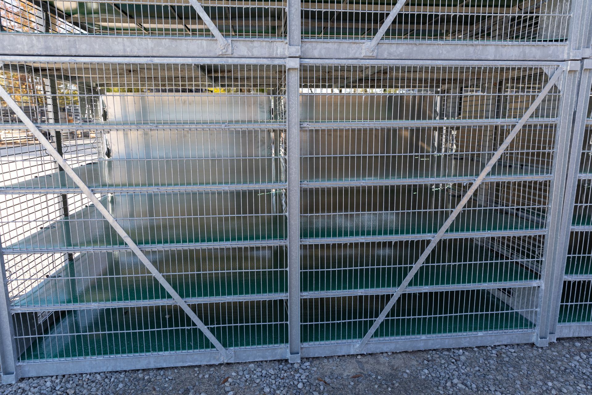 Metal cage with vertical bars, possibly a window guard or enclosure.