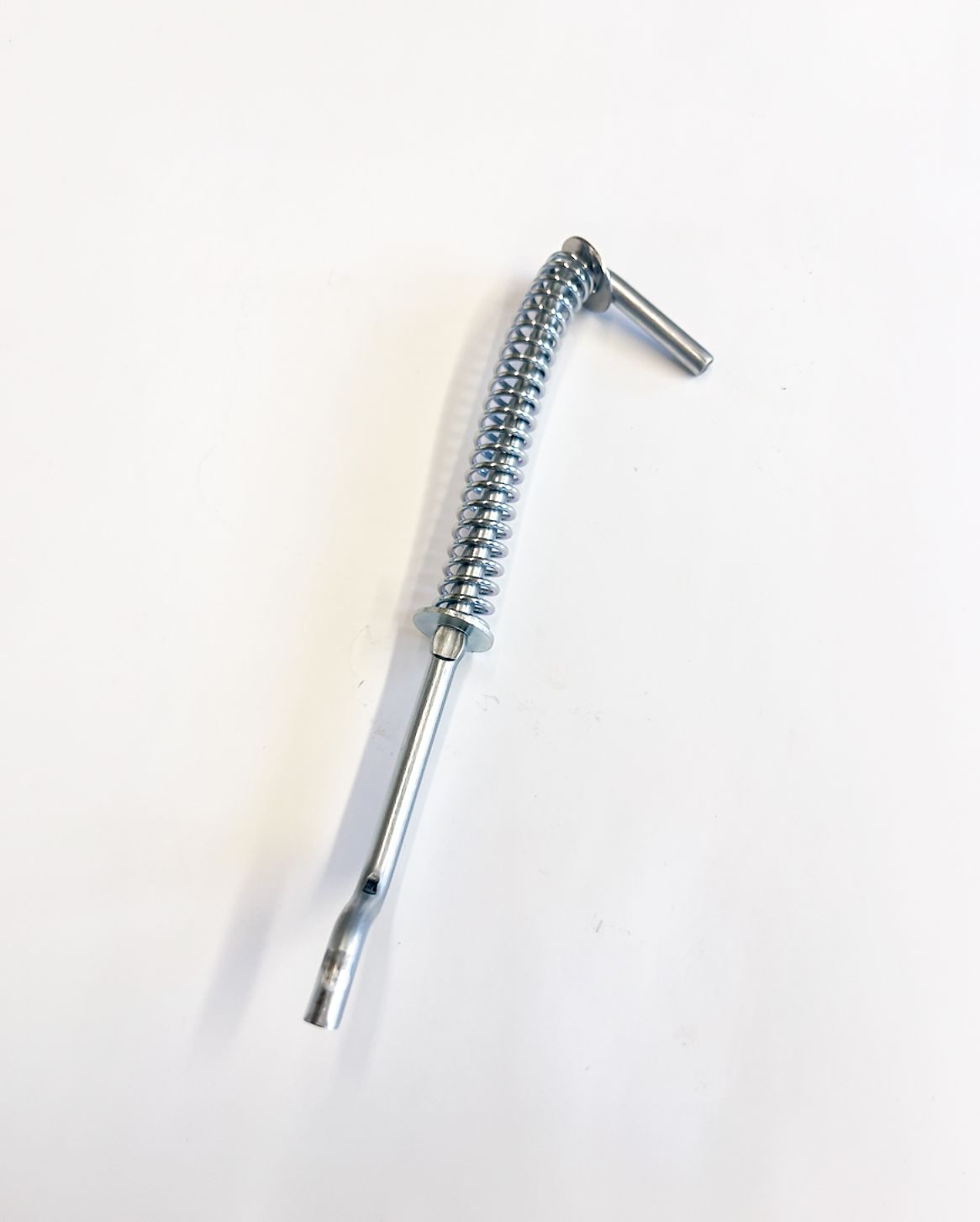 Bent metal rod with spring section; white background.