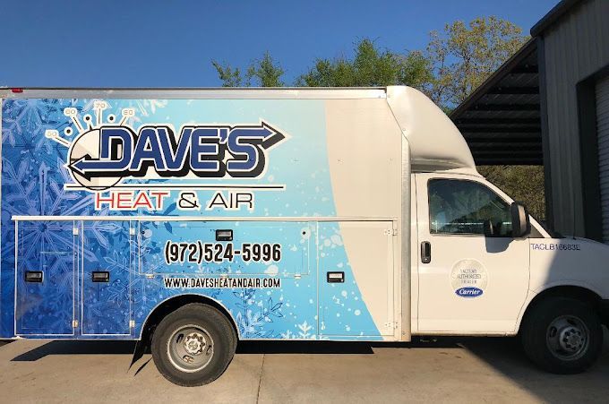A daves heat and air truck is parked in front of a building