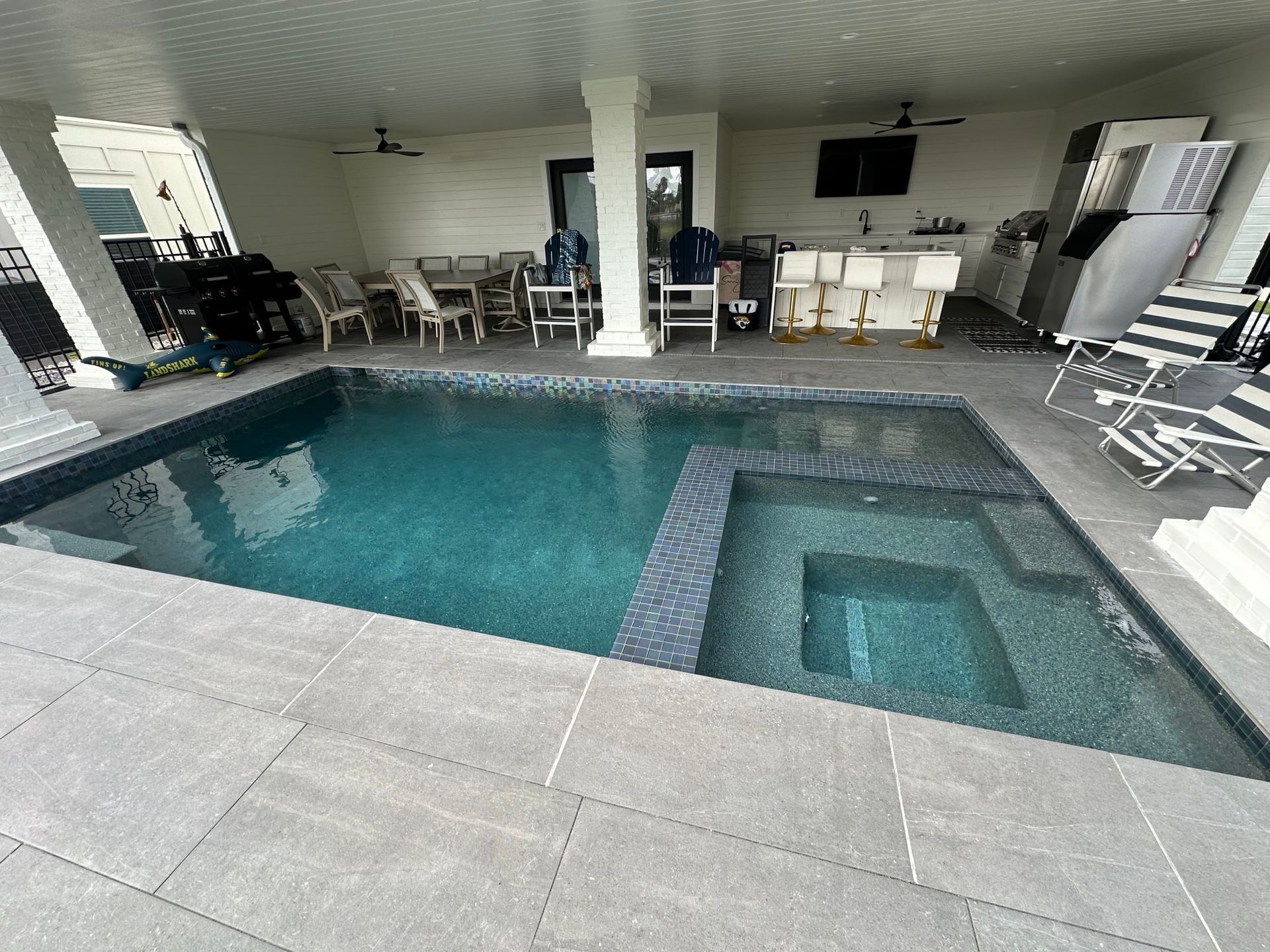 There is a large swimming pool in the middle of the room.