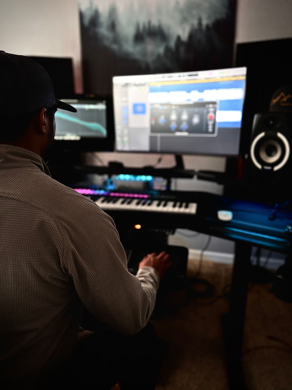 A dj controller is sitting on top of a case.