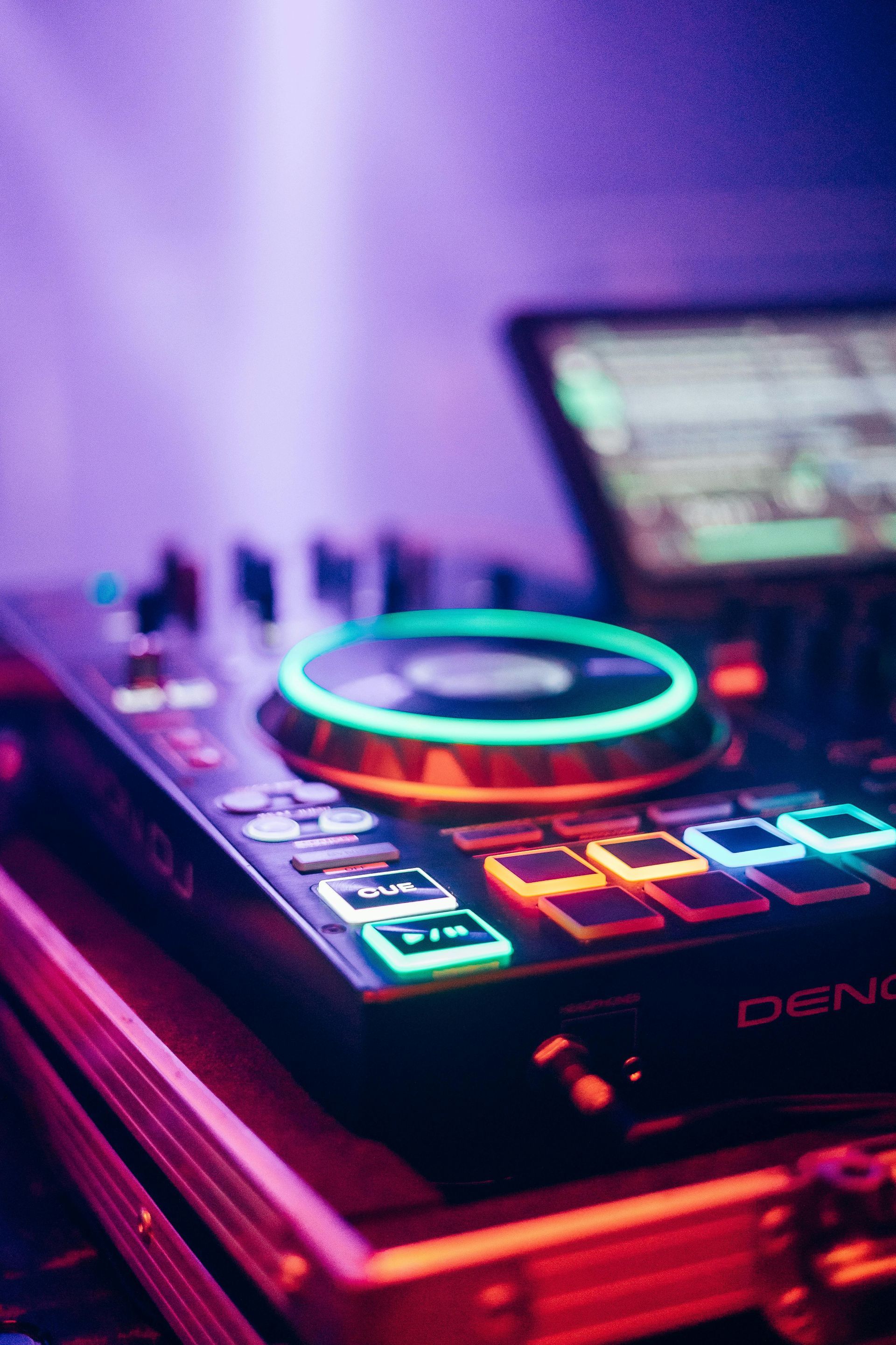 A dj controller is sitting on top of a case.