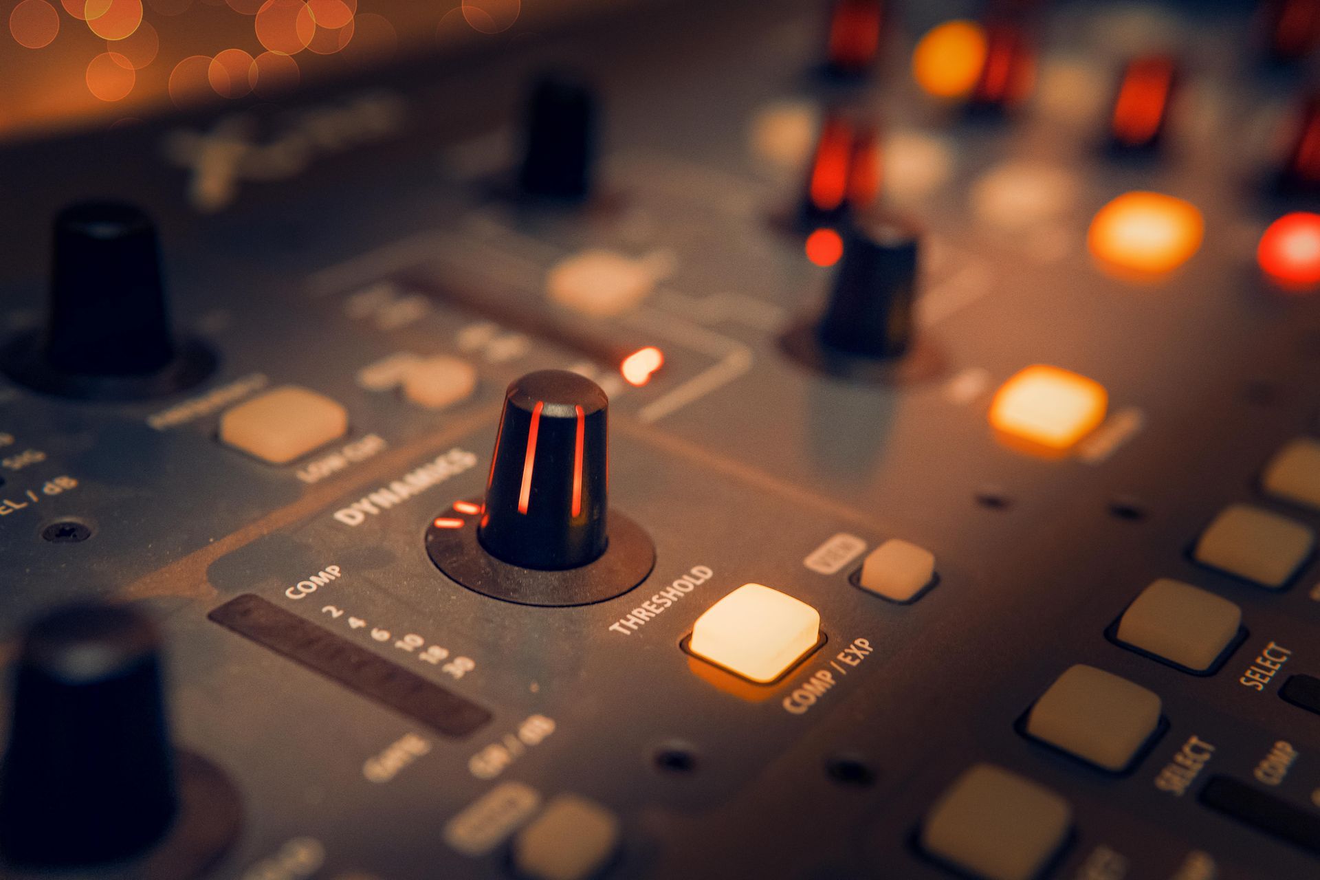 A close up of a control panel with buttons and knobs