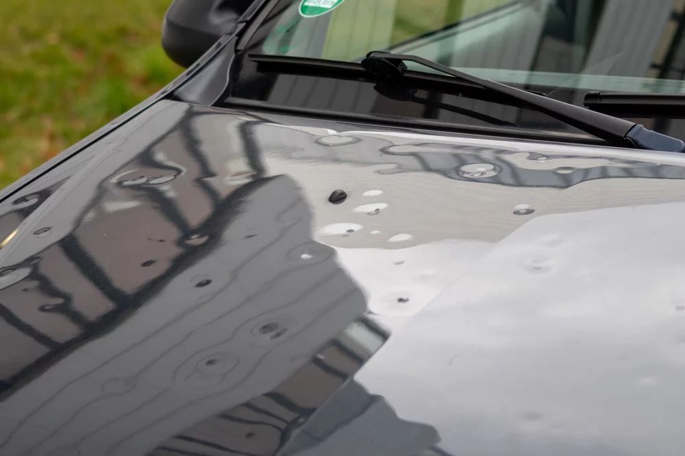 Car hood with hail damage