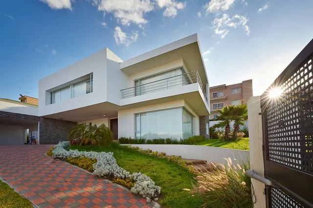 Modern White House With Red Brick Driveway — MDSR Group In Manunda, QLD
