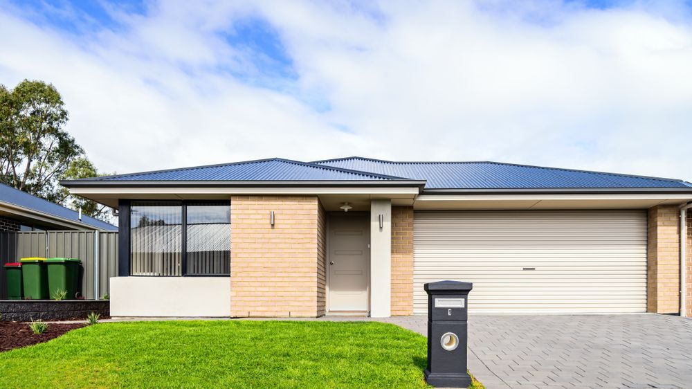 Modern Beige Brick Home With a Blue Roof — MDSR Group In Smithfield, QLD