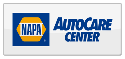 NAPA AutoCare Center logo: blue hexagon with "NAPA" and "AUTOCARE CENTER" text. White background.