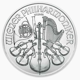 A silver coin with violins , a harp , and a trumpet on it.