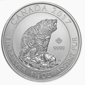 A silver coin with a picture of a bear on it.