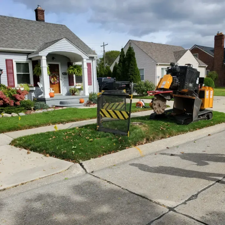 A house with a yellow and black sign in front of it