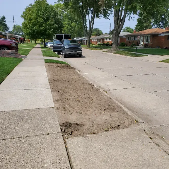 A car is parked on the side of a residential street