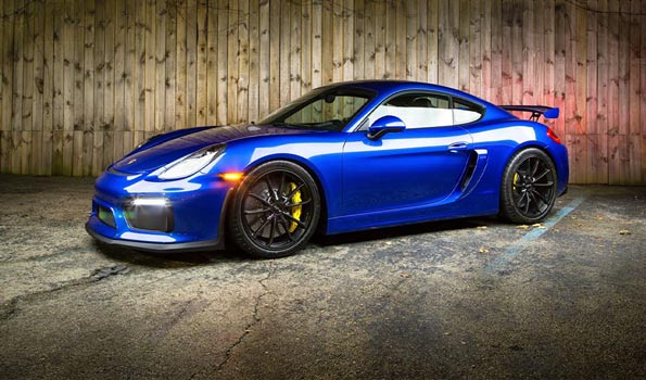 Blue GT4 Porsche in Front of Exquisite Auto Spa
