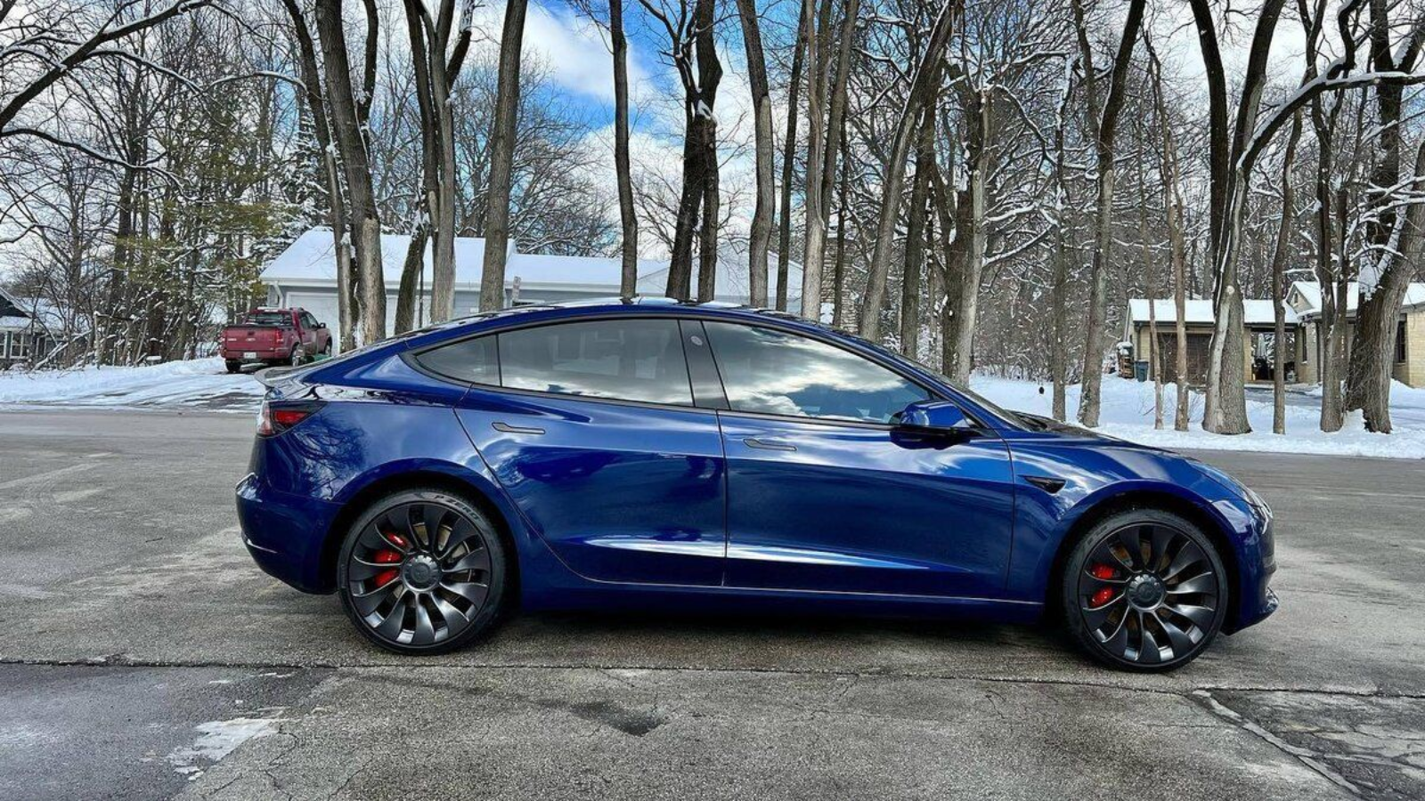 paint protection film installation on a blue Tesla