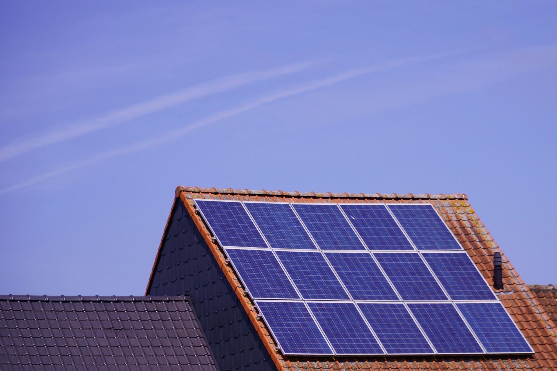 A roof with a lot of solar panels on it