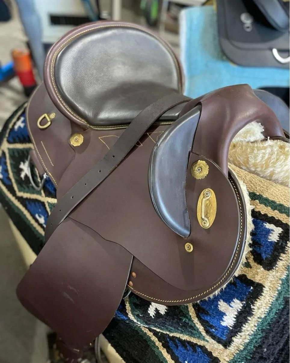 A Brown Leather Saddle Is Sitting on Top of A Blanket — Kempsey Produce & Saddlery in Kempsey, NSW