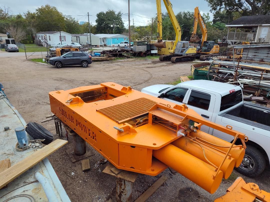 A metal cage with a wooden box inside of it
