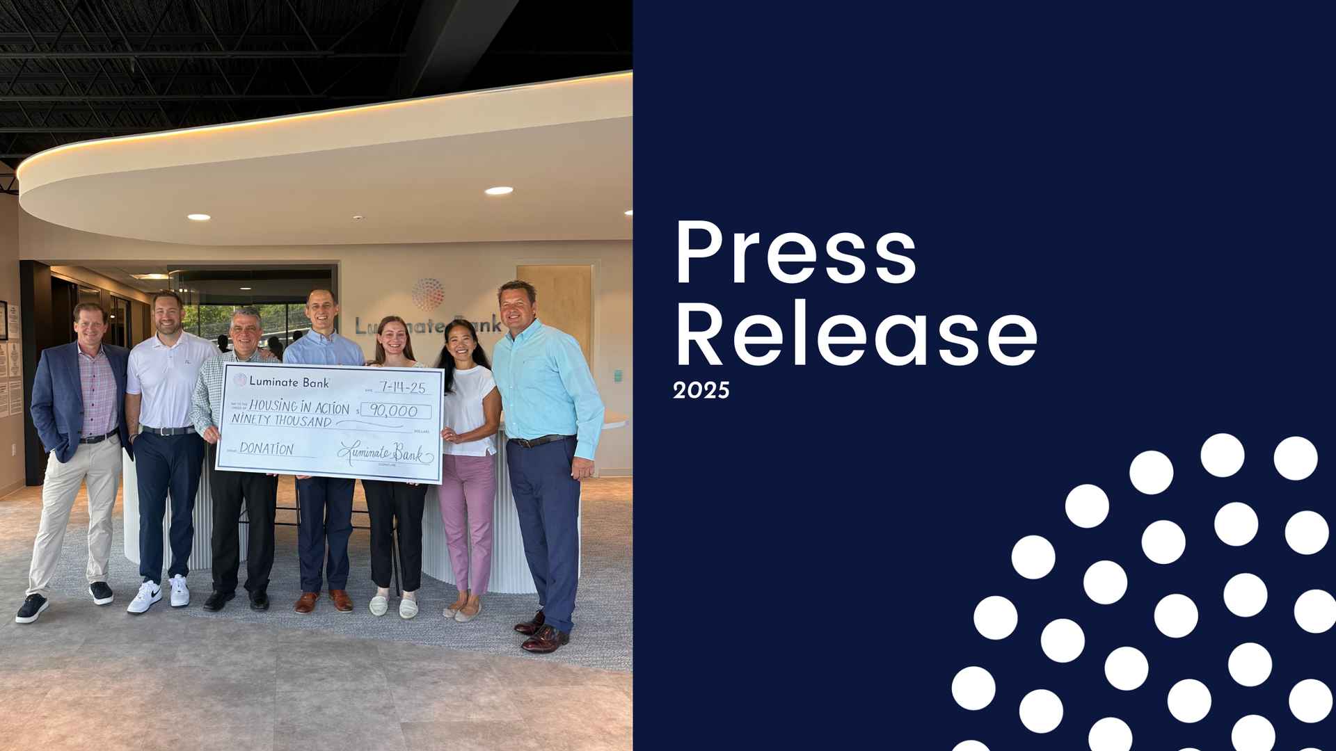 A group of people standing next to each other holding a large check.