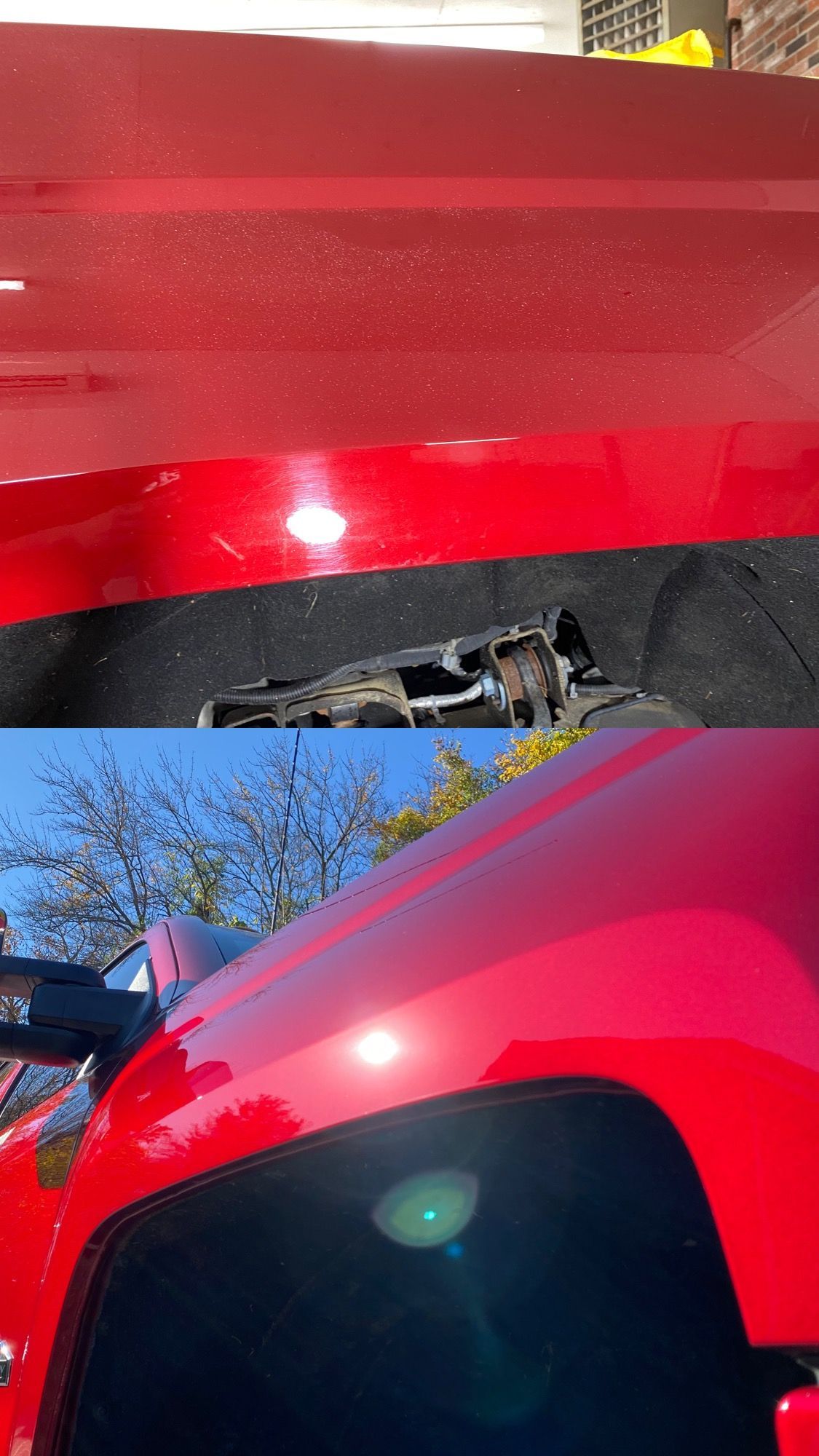 a close up of a red truck hood and fender .