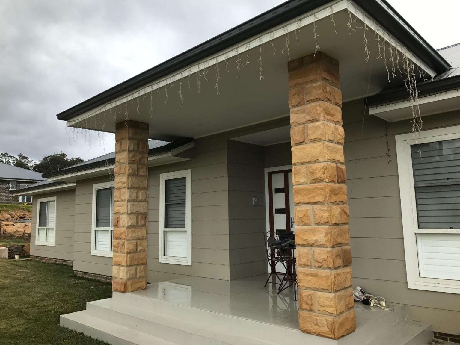 The Front Of A House With A Porch And Pillars — Lewis Landscapes In Yippin Creek, NSW