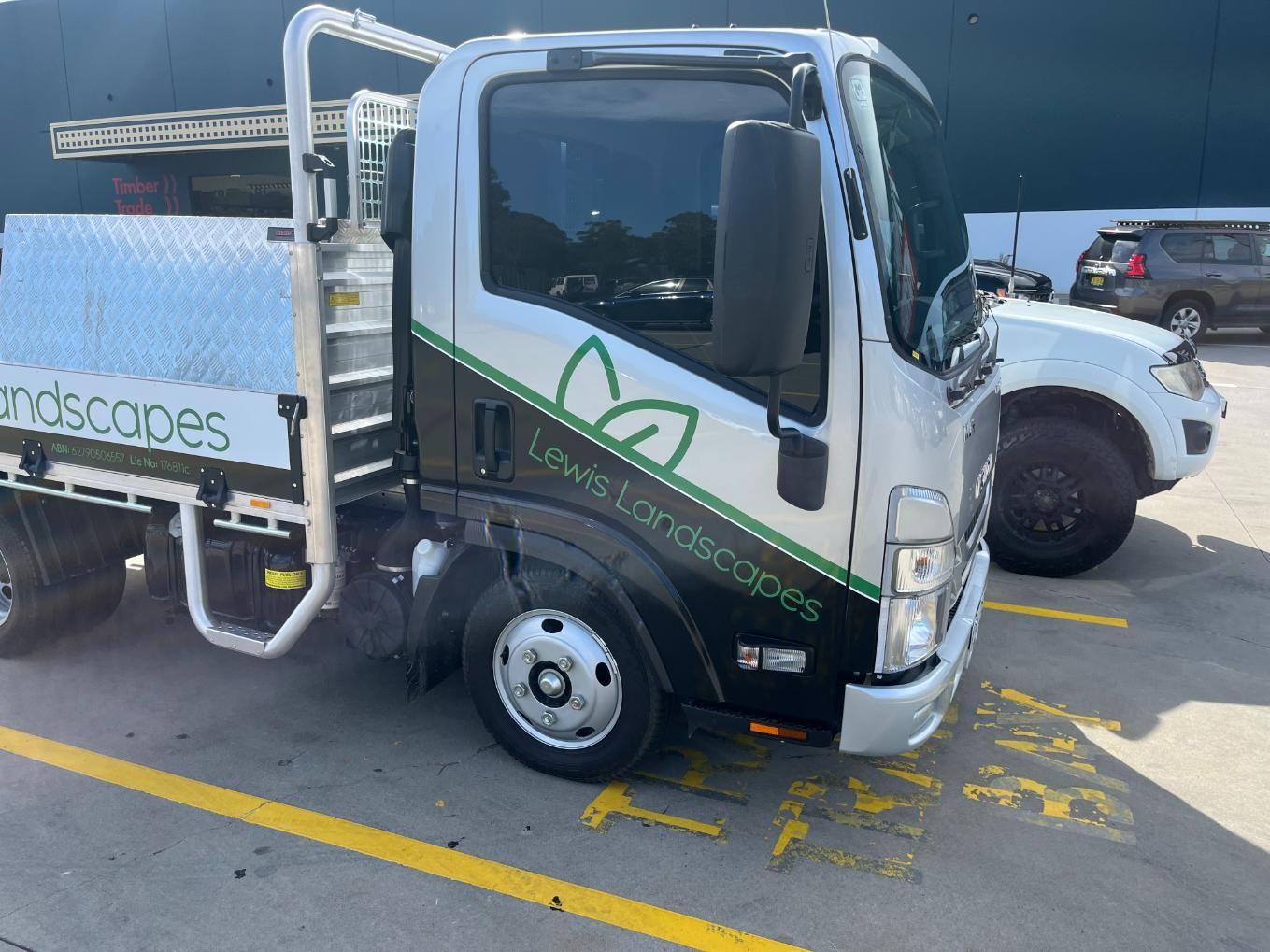 A White Truck Is Parked In A Parking Lot — Lewis Landscapes In Yippin Creek, NSW
