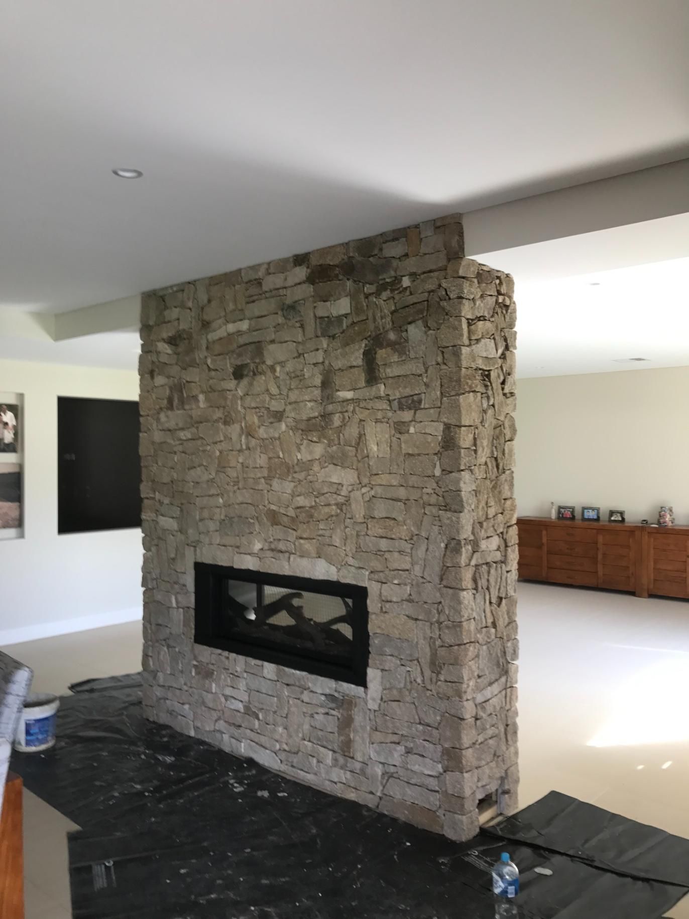 There Is A Fireplace In The Middle Of The Room — Lewis Landscapes In Yippin Creek, NSW