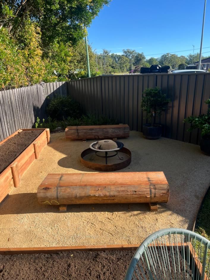 There Is A Fire Pit In The Middle Of The Backyard — Lewis Landscapes In Yippin Creek, NSW