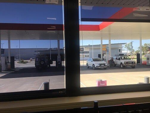 White blinds, trees outside — Blinds in Darwin NT