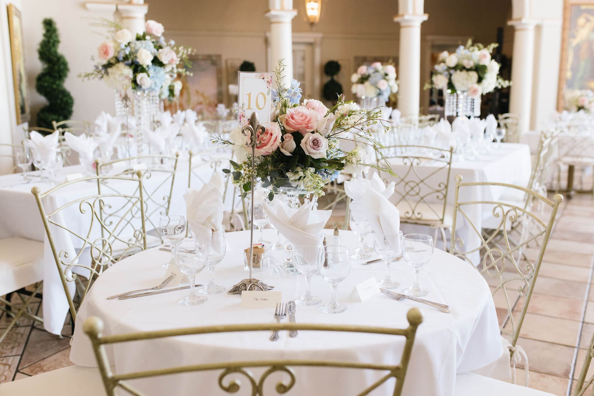 a table set for a wedding reception with a table number of 10