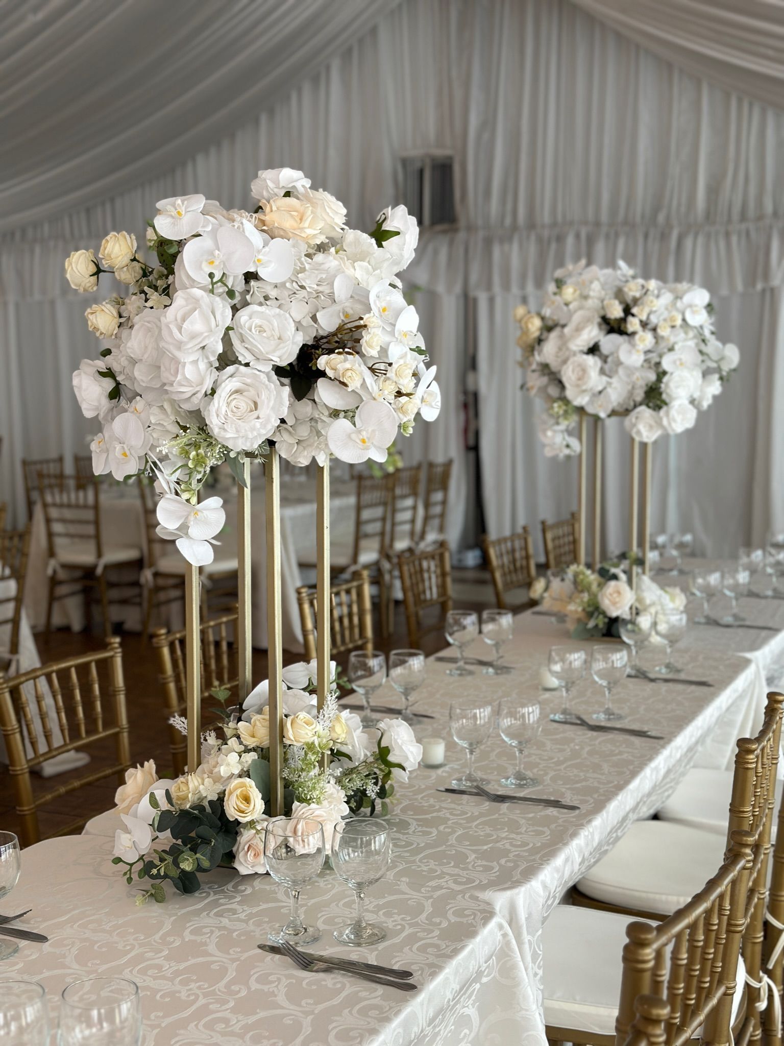 a long table with white flowers on it
