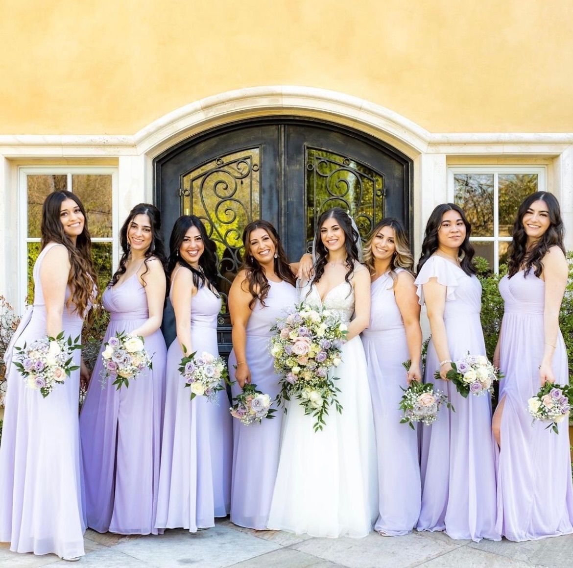 Wedding Party Holding Flower Bouquets