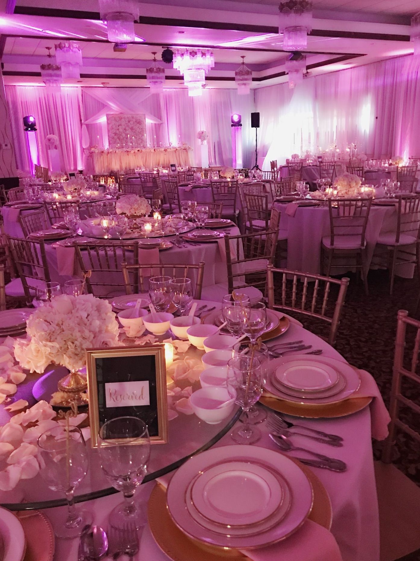 a large room with tables and chairs set up for a wedding reception