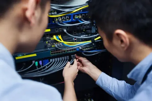 IT Engineer Inspecting Network Cable — Wilmington, NC — GSO Enterprises LLC