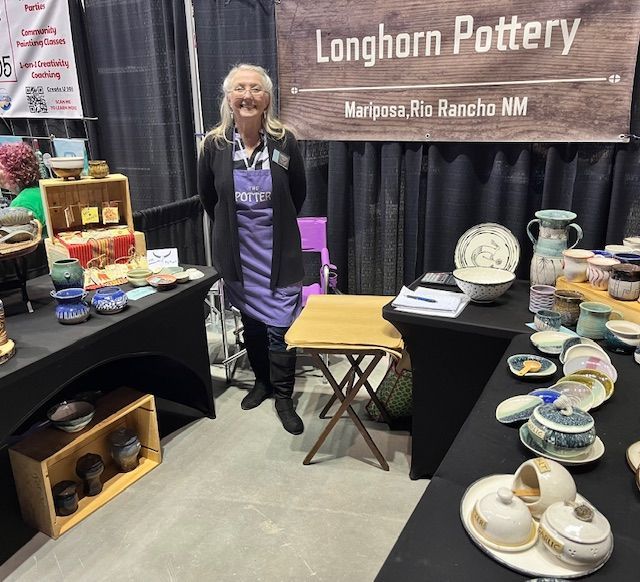 Woman at a pottery booth,