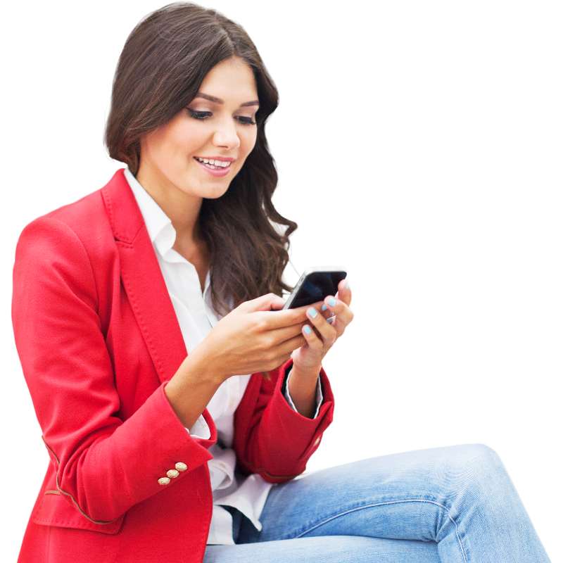 A woman in a red jacket is looking at her phone