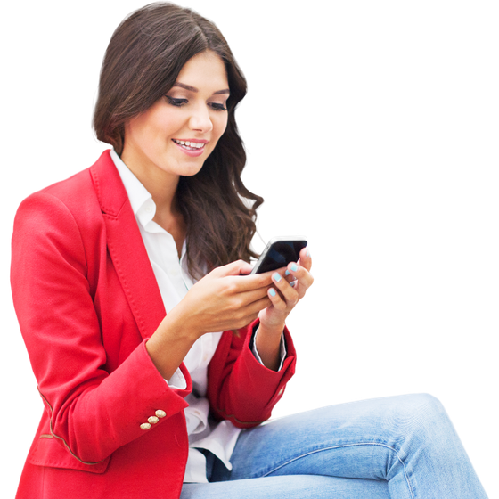 A woman in a red jacket is looking at her phone