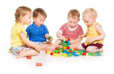 Childcare Solutions — Children Playing Toy Blocks in Leavenworth, KS