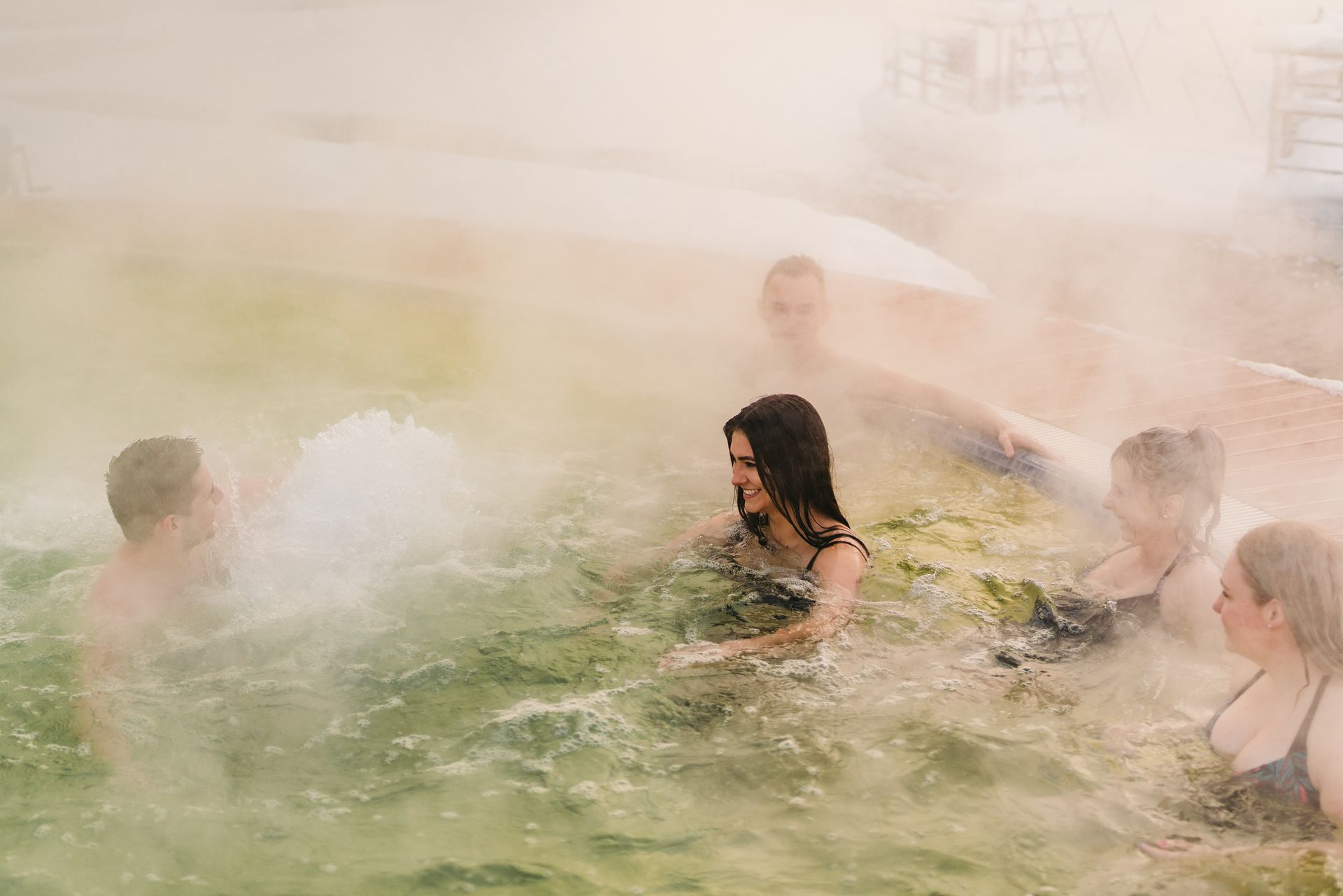 Termy Zakopiańskie winter — outdoor thermal pools with snow-covered Tatra Mountains Zakopane