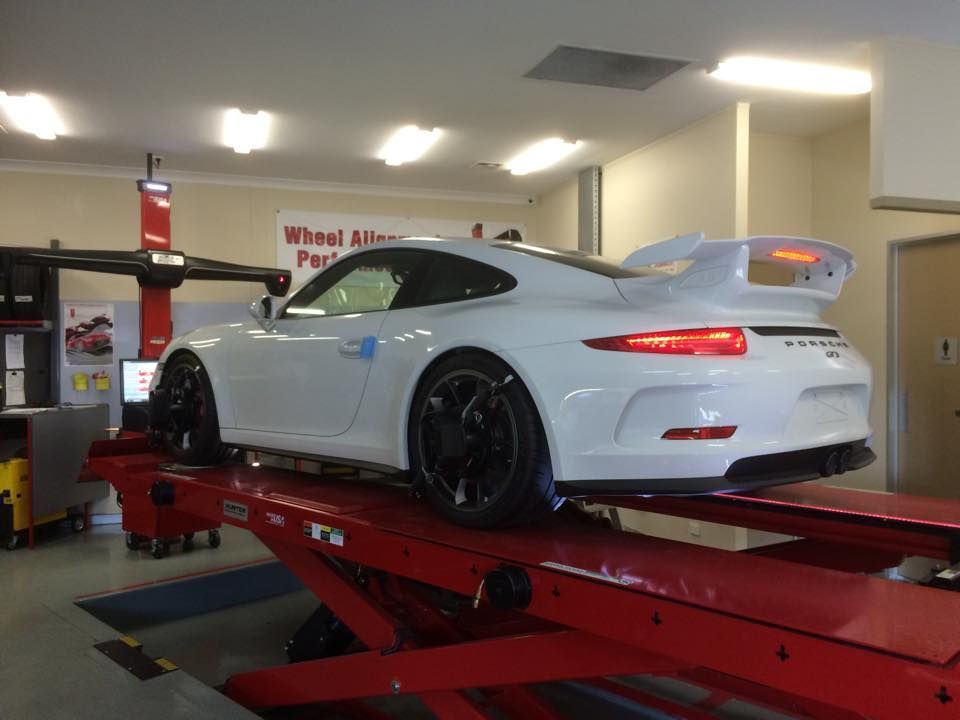 White Car With Brake Lights On — Rallimax Wheel Repairs & Alignments in Fyshwick, ACT
