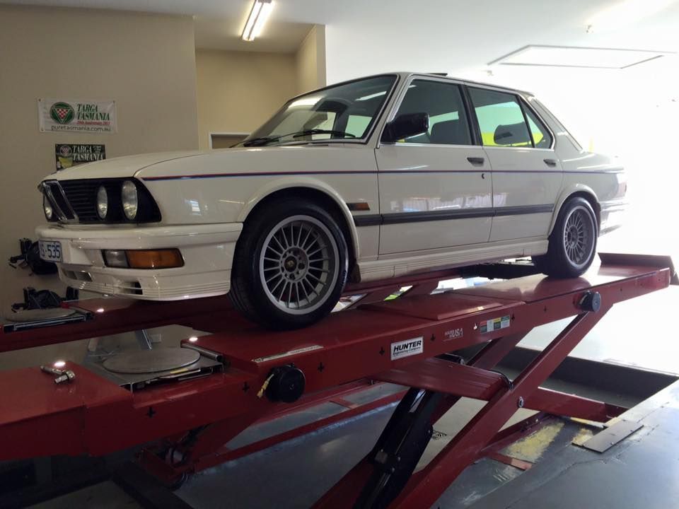 White Car On Stand — Rallimax Wheel Repairs & Alignments in Fyshwick, ACT