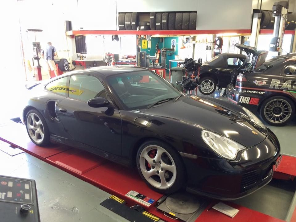 Dark Blue Car Getting Wheel Alignment — Rallimax Wheel Repairs & Alignments in Fyshwick, ACT