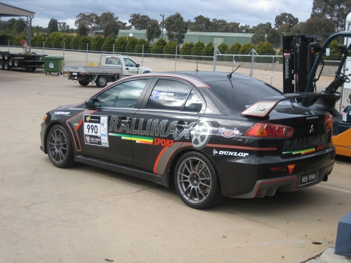 A Black Car With Logo On The Side — Rallimax Wheel Repairs & Alignments in Fyshwick, ACT