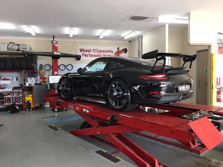 Black Racing Car — Rallimax Wheel Repairs & Alignments in Fyshwick, ACT