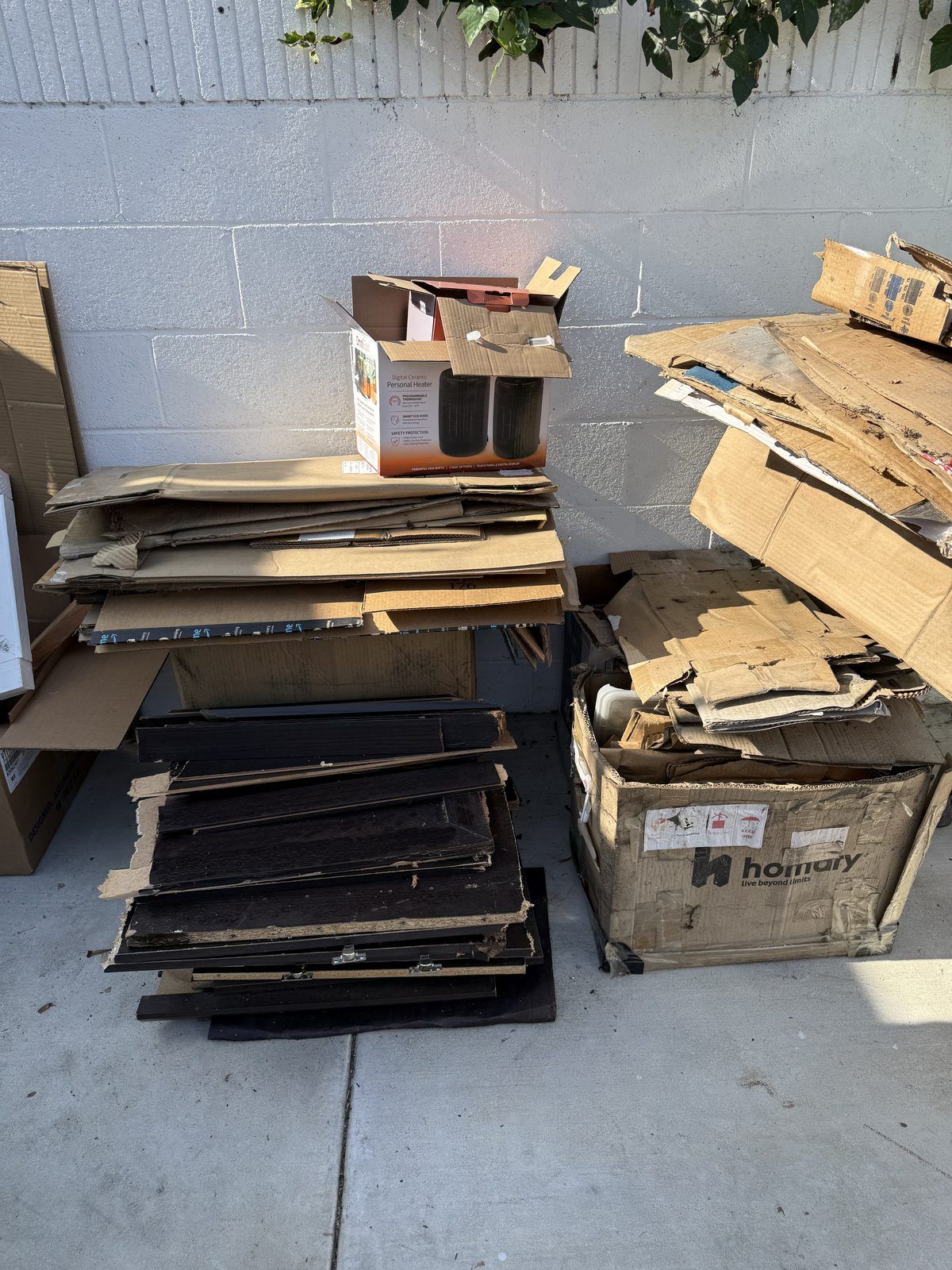 Close-up of stacked paper or cardboard sheets with layered edges and warm light.