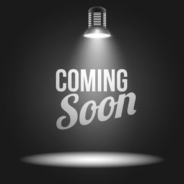 “Coming Soon” text under a spotlight on a dark background