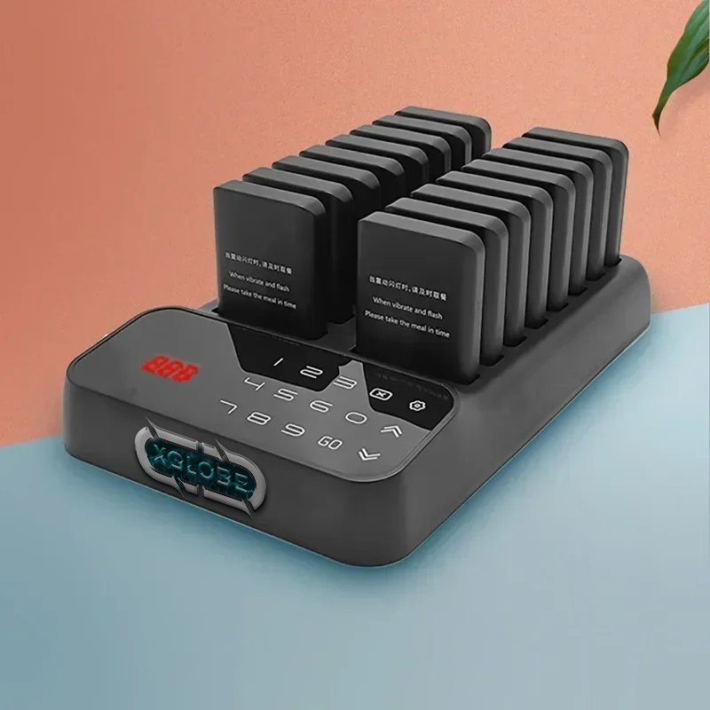 A remote control is sitting on top of a charger on a table.